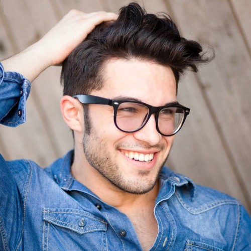 Man Touching Hair & Smiling